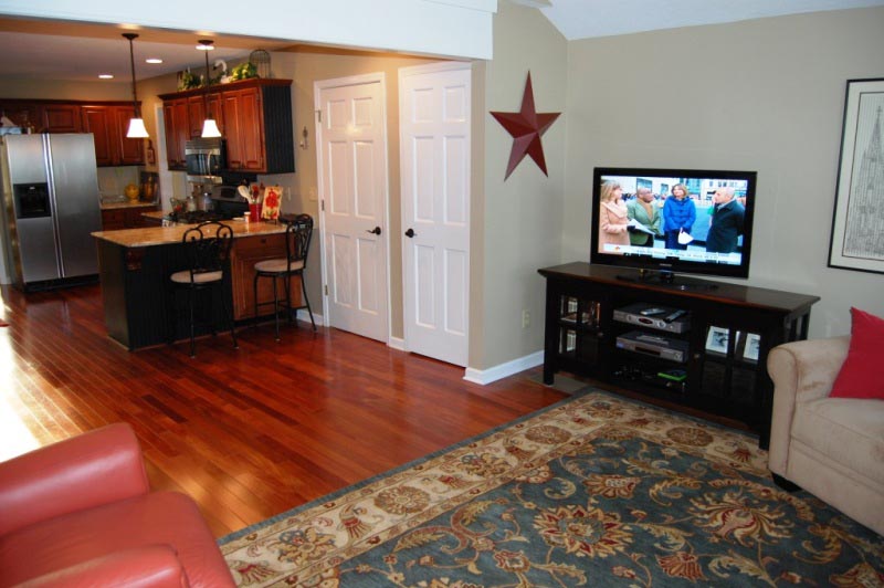 View showing wall removed between kitchen and sun room