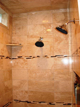 two shower heads and accessory corner shelves